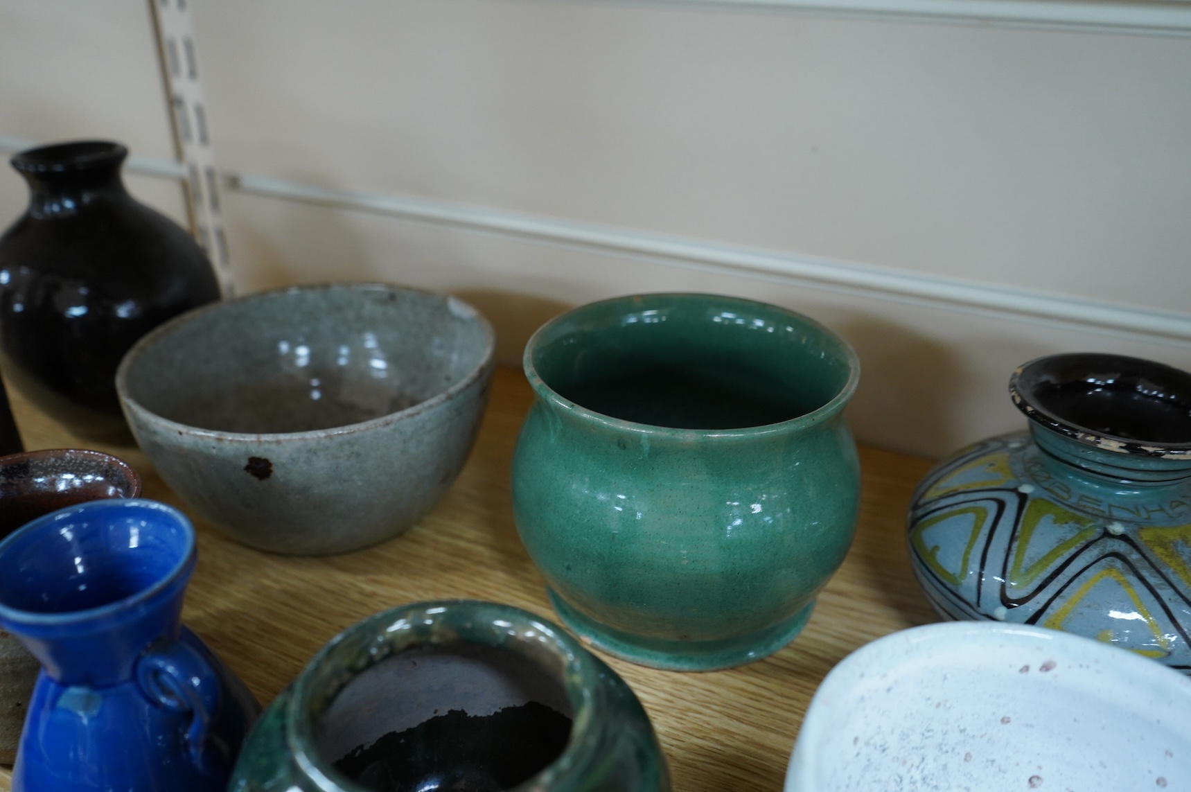 A collection of studio pottery to include a small Danish squat vase, a Brannam, Devon vase and three small Dickerware pieces, largest 13cm high